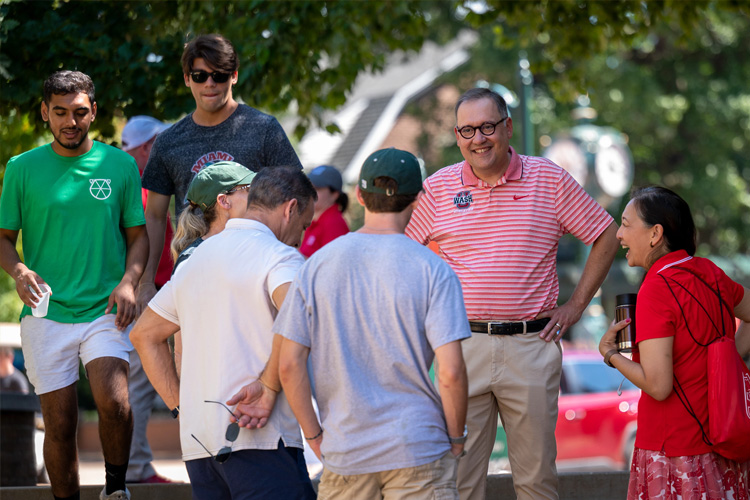 Chancellor Andrew Martin and Vice Chancellor Anna Gonzalez talk with students and families